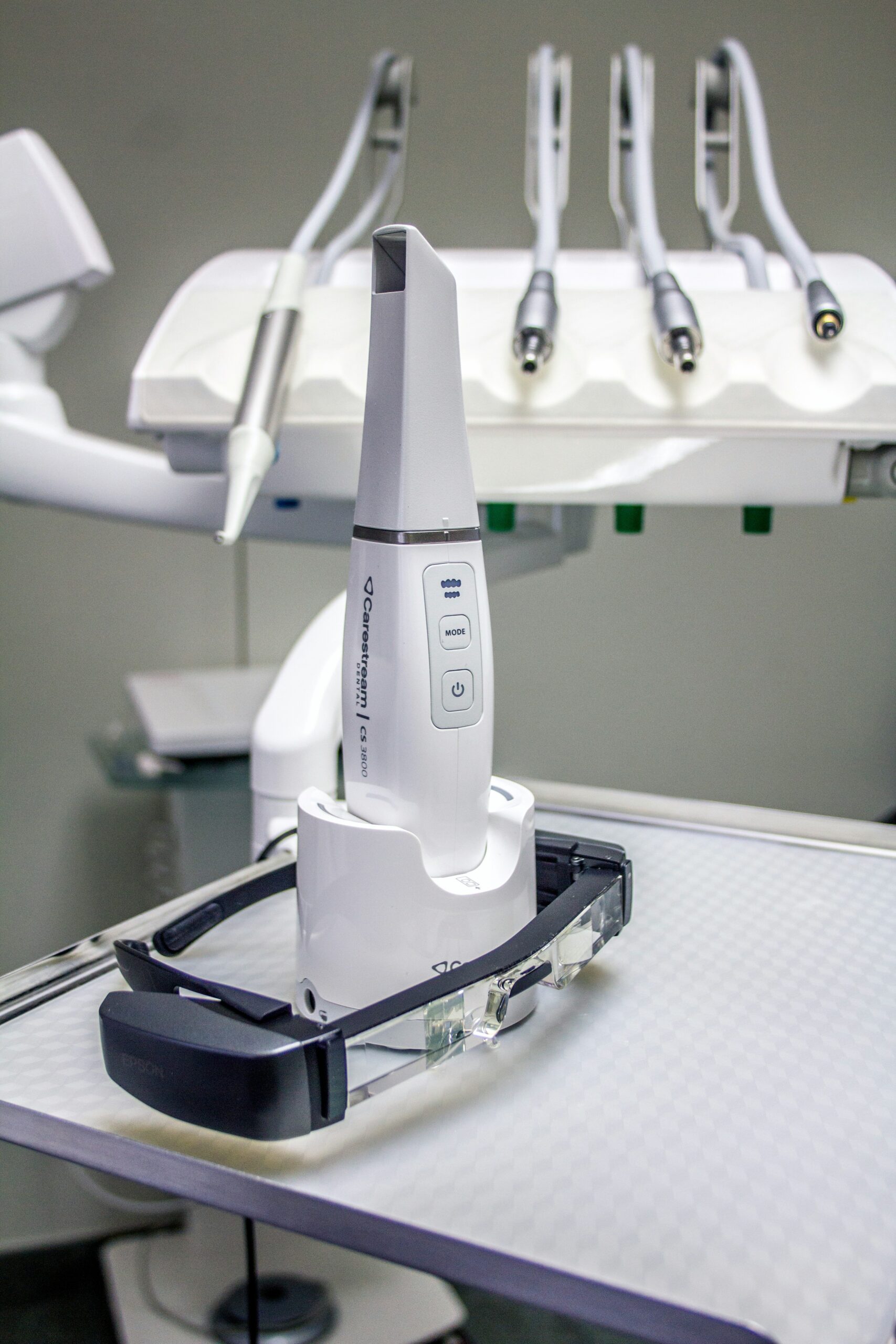 a white robot sitting on top of a table